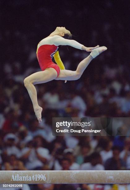 Qiao Ya of China competing in the Balance Beam event of the Women's artistic team all-around competition during the XXVI Summer Olympic Games on 23...