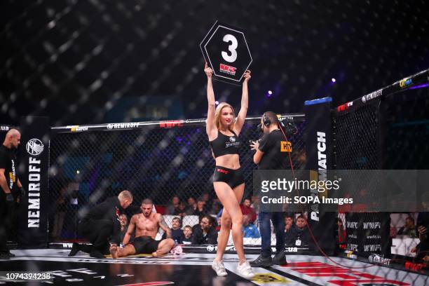 Ukrainian girl is showing No. 3 placard whiche mean the beginning of third round match during the WWFC 13 in Kiev.