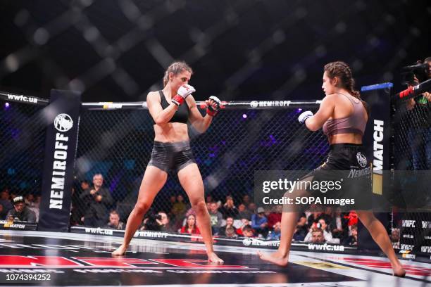 Hara Dimitroula from Greece and Alisa Danyuk from Ukraine seen fighting together during the WWFC 13 in Kiev. Alisa Danyuk won the match.