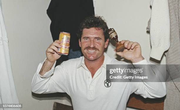 Australia captain Allan Border pictured with a can of Castlemaine XXXX beer and the Ashes Urn after the 6th Test Match against England at Oval on...