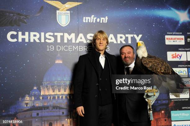 Dusan Basta of SS Lazio with SS Lazio mascotte eagle poses during the SS Lazio Christmas dinner at Spazio Novecento on December 19, 2018 in Rome,...