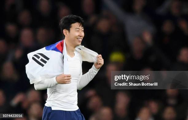 Heung-Min Son of Tottenham Hotspur holds a South-Korean flag after the Carabao Cup Quarter Final match between Arsenal and Tottenham Hotspur at...