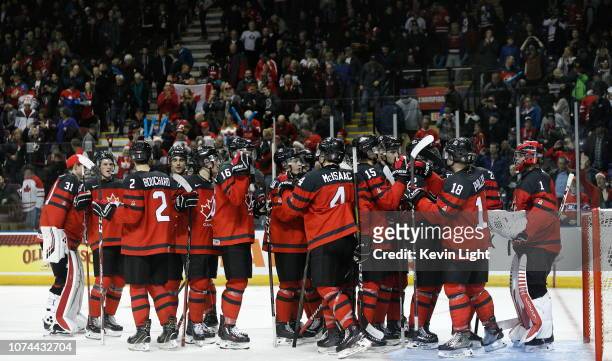 Team Canada celebrates their 5-3 victory versus Team Switzerland at the IIHF World Junior Championships at the Save-on-Foods Memorial Centre on...