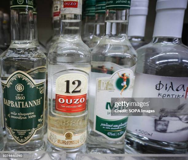 Variety of Ouzo are seen on the shelf of a supermarket deli in Athens.