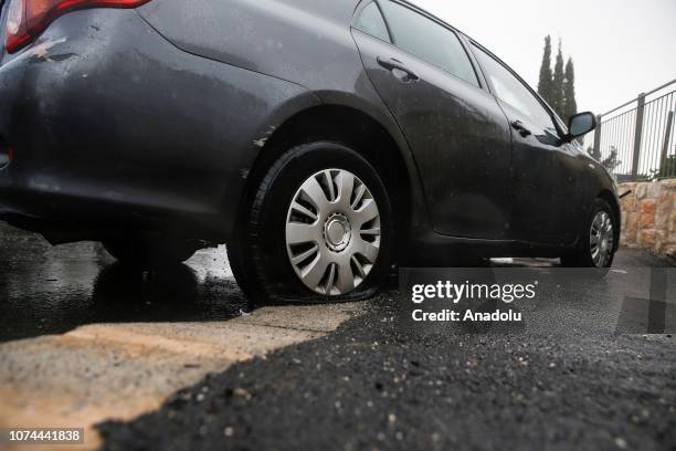 Vehicle of a Palestinian with tire blowout is seen following the attacks of ultra-nationalist Jews in Pisgat Ze'ev east of Beit Hanina in East...