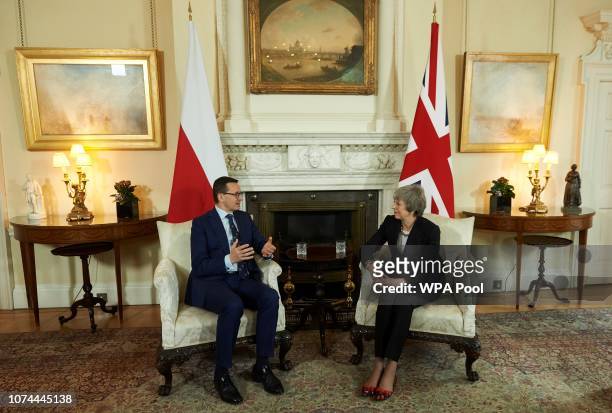 British Prime Minister Theresa May talks with Polish Prime Minister Mateusz Morawiecki during their bilateral meeting ahead of the UK-Poland...