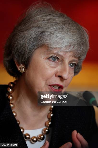 Britain's Prime Minister Theresa May speaks to Poland's Prime Minister Mateusz Morawiecki during the UK-Poland Inter-Governmental Consultations at...