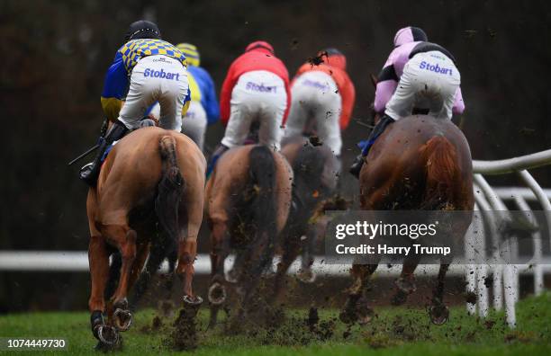 Large amount of ground flies up as runners make their way around the course on their way to winning the starsports.bet Handicap Hurdle at Exeter...