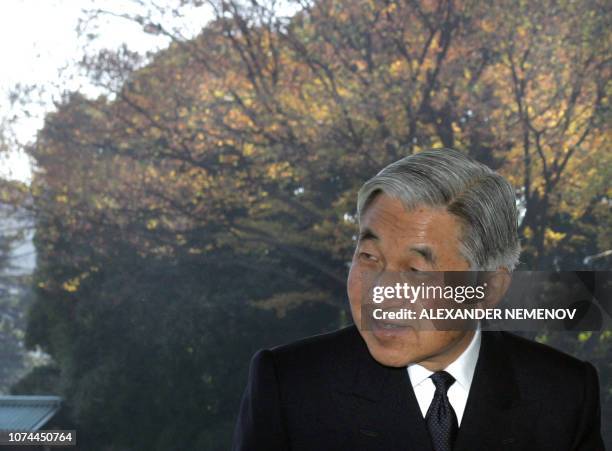 Japanese Emperor Akihito bids farewell to Russian President Vladimir Putin after their meeting at the palace in Tokyo, 22 November 2005. Putin warned...