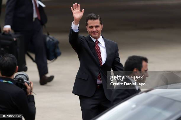 President of Mexico Enrique Peña Nieto waves as he arrives to Buenos Aires for G20 Leaders' Summit 2018 at Ministro Pistarini International Airport...