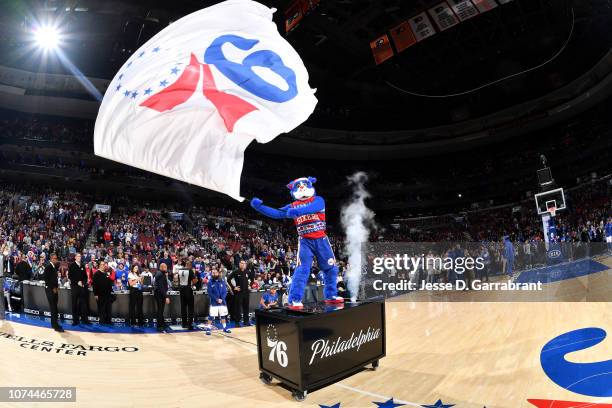 The mascot of the Philadelphia 76ers wave a flag before the game against the New York Knicks on December 19, 2018 at the Wells Fargo Center in...