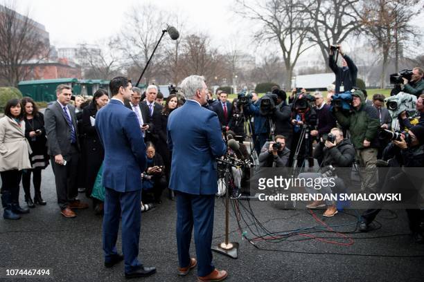 Speaker of the House Paul Ryan listens while House Majority Leader Representative Kevin McCarthy makes a statement to the press after a meeting with...