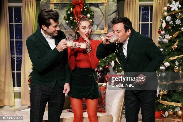 Episode 0986 -- Pictured: Musician Mark Ronson, singer Miley Cyrus, and host Jimmy Fallon during "Santa Baby" on December 20, 2018 --