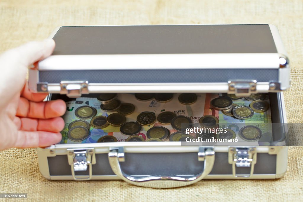 Metal briefcase, cash box, Suitcase stuffed with cash