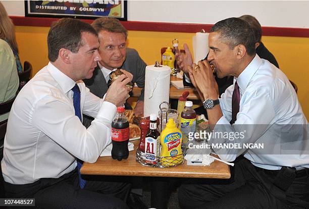 President Barack Obama and Russian President Dmitry Medvedev eat burgers during a lunch at Ray's Hell Burger June 24, 2010 in Arlington, Virginia....