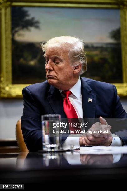President Donald J. Trump speaks at a roundtable with family members of victims, state and local officials, and Cabinet members to discuss...