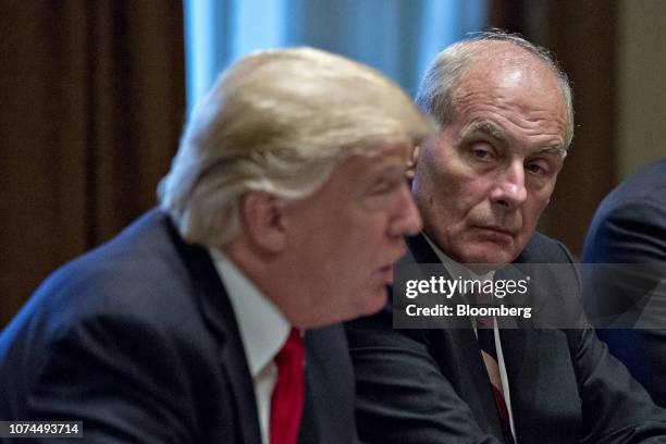 John Kelly, White House chief of staff, listens as U.S. President Donald Trump, left, speaks during a briefing with senior military leaders in the...