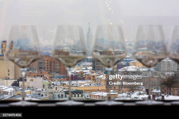 Properties stand on the city skyline seen through a viewing window at the White Rabbit restaurant in Moscow, Russia, on Tuesday, Dec. 4, 2018. A...