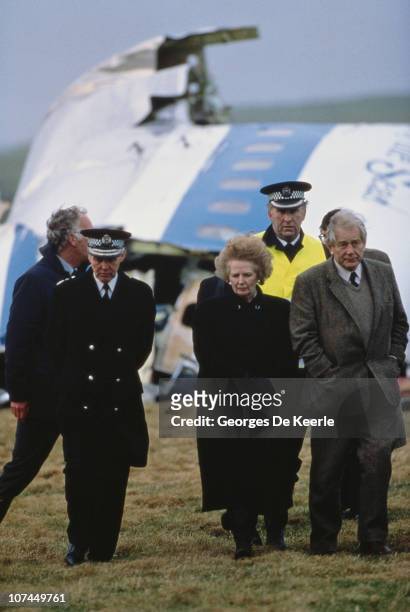 British Prime Minister Margaret Thatcher with police officers at the wreck of Pan Am Flight 103 after it crashed onto the town of Lockerbie in...