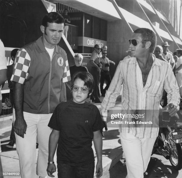 American actor Steve McQueen with his son Chad at the California-500 Indycar race in Ontario, California, September 1971.