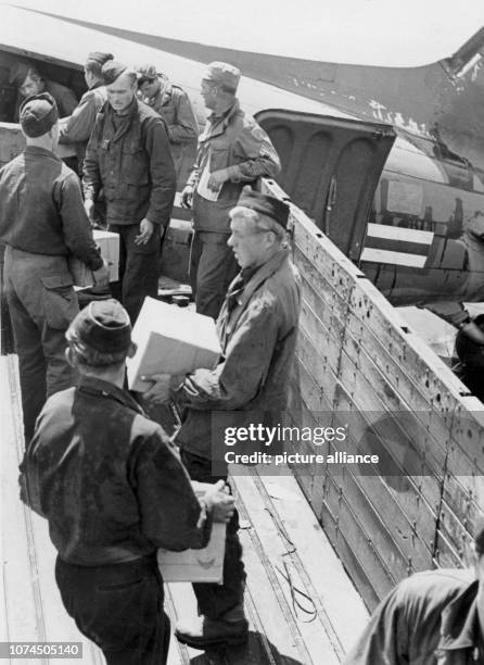 Plane of the US Air Force is being unloaded on 28 June 1948 at Berlin-Tempelhof airport. 50 years ago, on 24 June 1948, the USSR imposed a blockade...