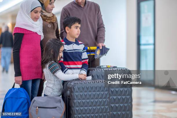 muslim family waiting - lost generation stock pictures, royalty-free photos & images