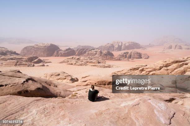 wadi rum (views across to saudi arabia) - saudi bedouin stock pictures, royalty-free photos & images