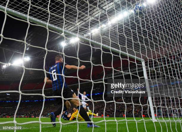 Christian Eriksen scores the winning goal for Tottenham Hotspur during the Group B match of the UEFA Champions League between Tottenham Hotspur and...