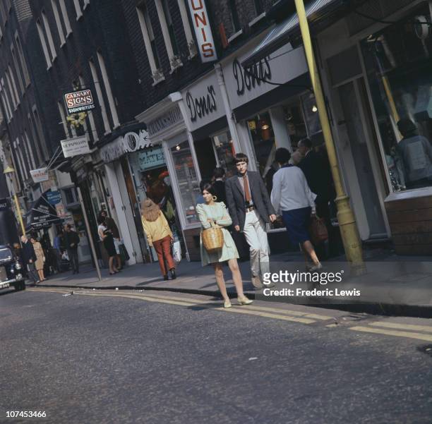 Shoppers on Carnaby Street, London, circa 1968.