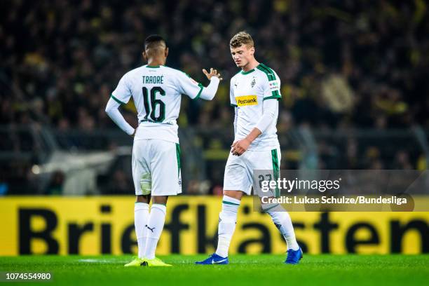 Ibrahima Traore of Moenchengladbach and Mickael Cuisance of Moenchengladbach look dejected after loosing the Bundesliga match between Borussia...