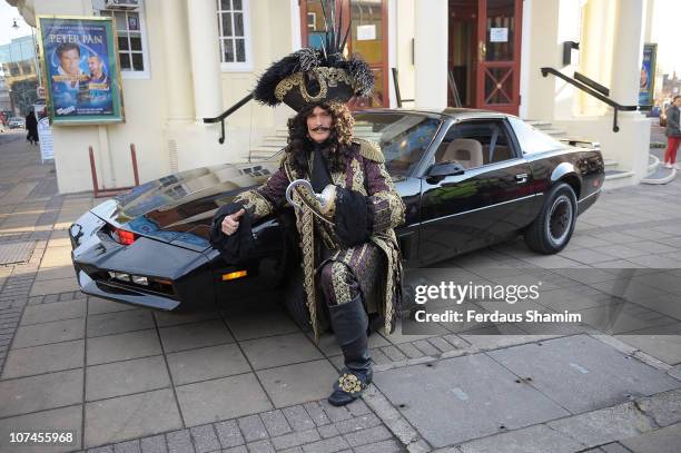 David Hasselhoff poses alongside KITT car to launch the Peter Pan pantomime at New Wimbledon Theatre on December 9, 2010 in Wimbledon, England.