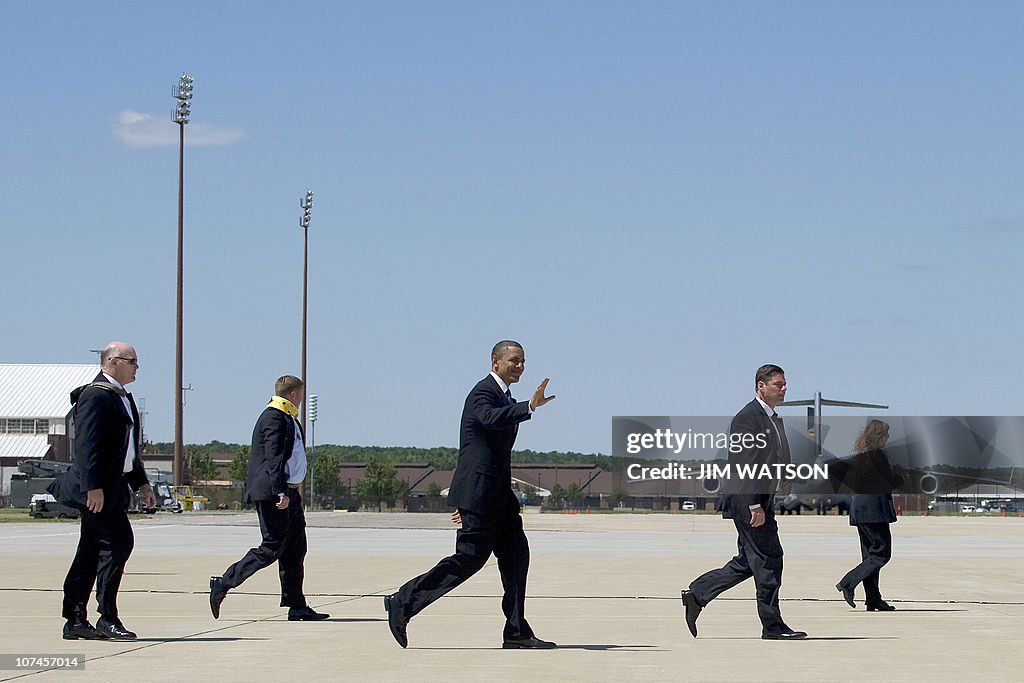 US President Barack Obama (C) walks to A