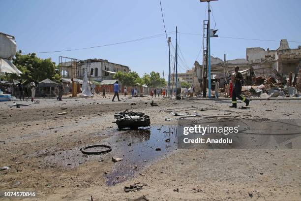 Explosion site is seen after a suicide car bombing targeted a security checkpoint near the presidential palace in Mogadishu, Somalia on December 22,...
