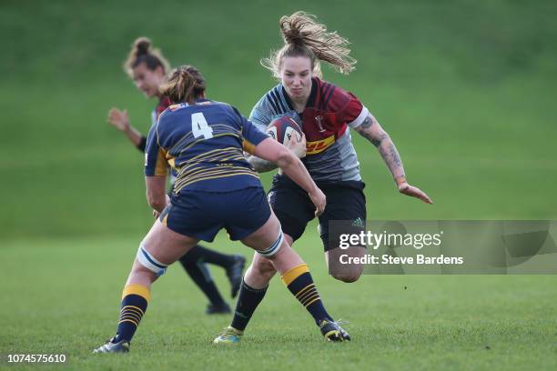 Jade Konkel of Harlequins Ladies takes on Bec Clough of Worcester Valkyries during the Tyrrells Premier 15s match between Harlequins Ladies and...