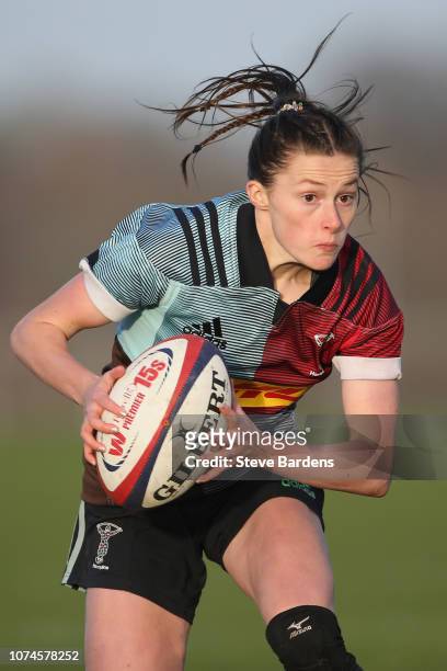 Lucy Packer of Harlequins Ladies runs with the ball during the Tyrrells Premier 15s match between Harlequins Ladies and Worcester Valkyries at Surrey...