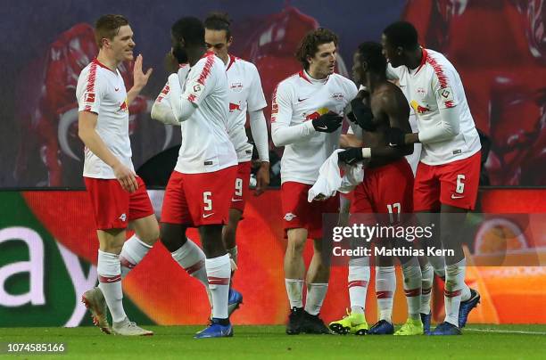 Bruma of Leipzig celebrates with teammates after scoring his team's third goal during the Bundesliga match between RB Leipzig and SV Werder Bremen at...