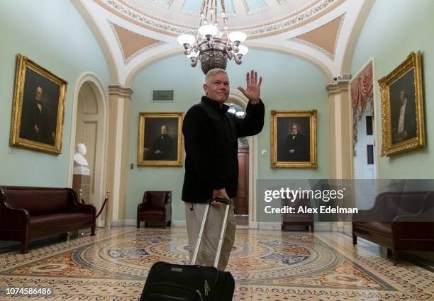 Rep. Pete Sessions waves to reporters as he departs the U.S. Capitol on December 22, 2018 in Washington, DC. Democrats refused to agree with...