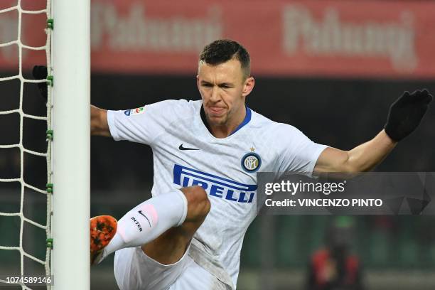 Inter Milan's Croatian midfielder Ivan Perisic kicks the goal's post as he celebrates after opening the scoring during the Italian Serie A Football...