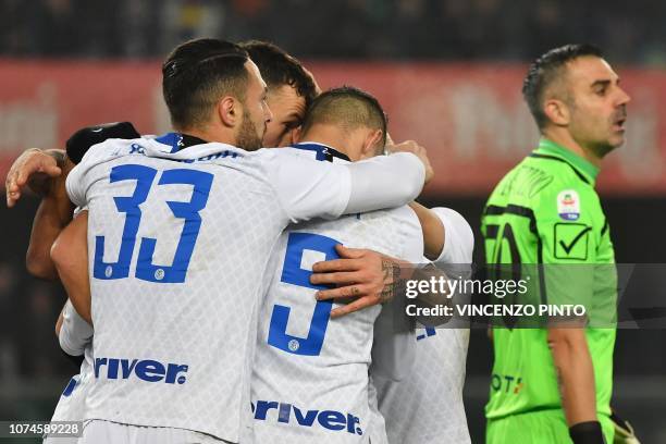 Inter Milan's Italian defender Danilo D'Ambrosio celebrates with teammates as Chievo's Italian goalkeeper Stefano Sorrentino looks on after Inter...