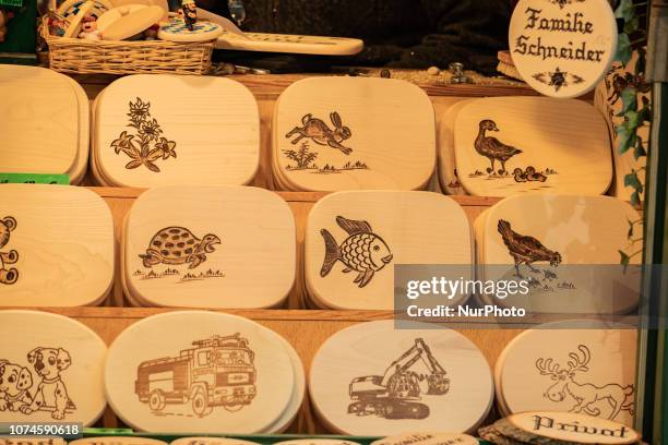 Some boards to eat on with animals pictured. The most important christmas market of Munich at Marienplatz was full of visitors because of the warm...