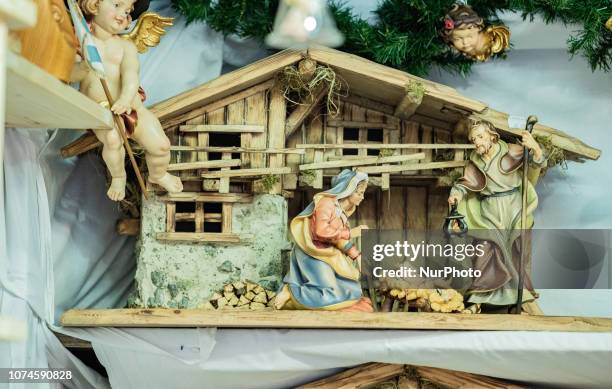 Creche with Joseph, Maria and little Jesus. The most important christmas market of Munich at Marienplatz was full of visitors because of the warm...