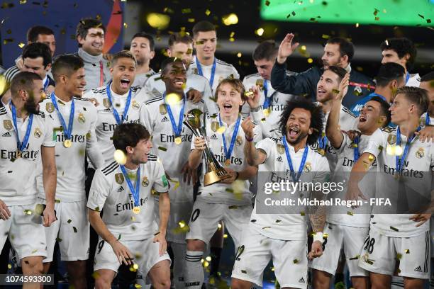 Luka Modric of Real Madrid lifts the FIFA Club World Cup trophy following the FIFA Club World Cup UAE 2018 Final between Al Ain and Real Madrid at...