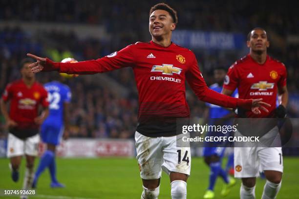 Manchester United's English midfielder Jesse Lingard celebrates after scoring their fourth goal from the penalty spot during the English Premier...