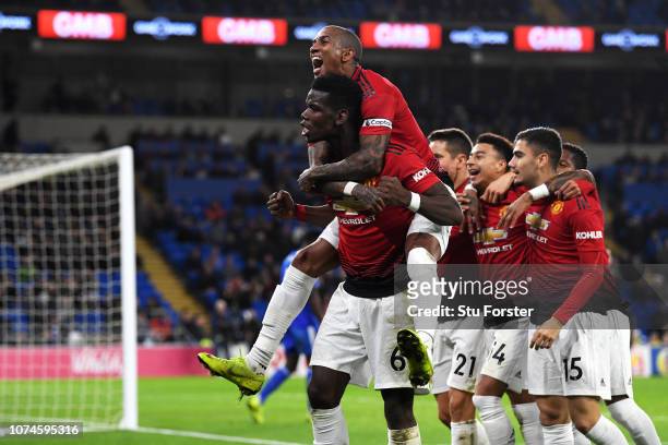 Paul Pogba of Manchester United and Ashley Young of Manchester United celebrate as teammate Jesse Lingard scores their team's fifth goal during the...