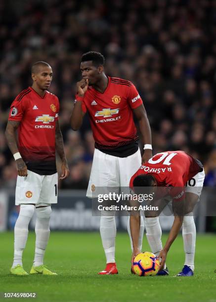 Paul Pogba and Ashley Young in discussion as Marcus Rashford of Manchester United places the ball for a free kick during the Premier League match...