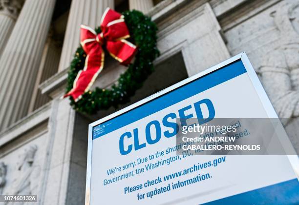 Sign is displayed at the National Archives building that is closed because of a US government shutdown in Washington, DC, on December 22, 2018. - The...