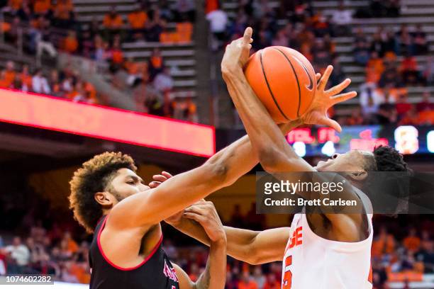 Tyus Battle of the Syracuse Orange is fouled as he drives to the basket by Tristin Walley of the Arkansas State Red Wolves during the second half at...