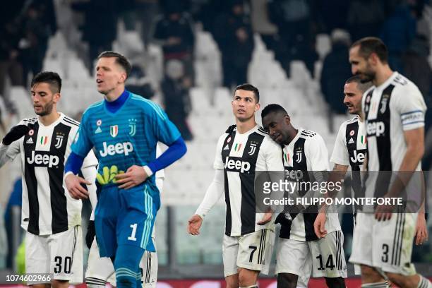 Juventus' Portuguese forward Cristiano Ronaldo , Juventus' French midfielder Blaise Matuidi and teammates celebrate at the end of the Italian Serie A...