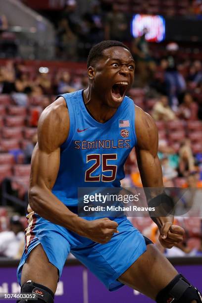 Mfiondu Kabengele of the Florida State Seminoles reacts after a dunk against the Saint Louis Billikens during the Orange Bowl Basketball Classic at...