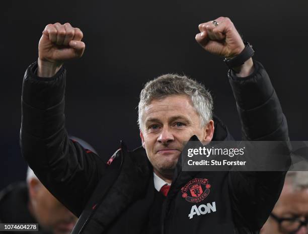 Ole Gunnar Solskjaer, Interim Manager of Manchester United celebrates with the fans after the Premier League match between Cardiff City and...